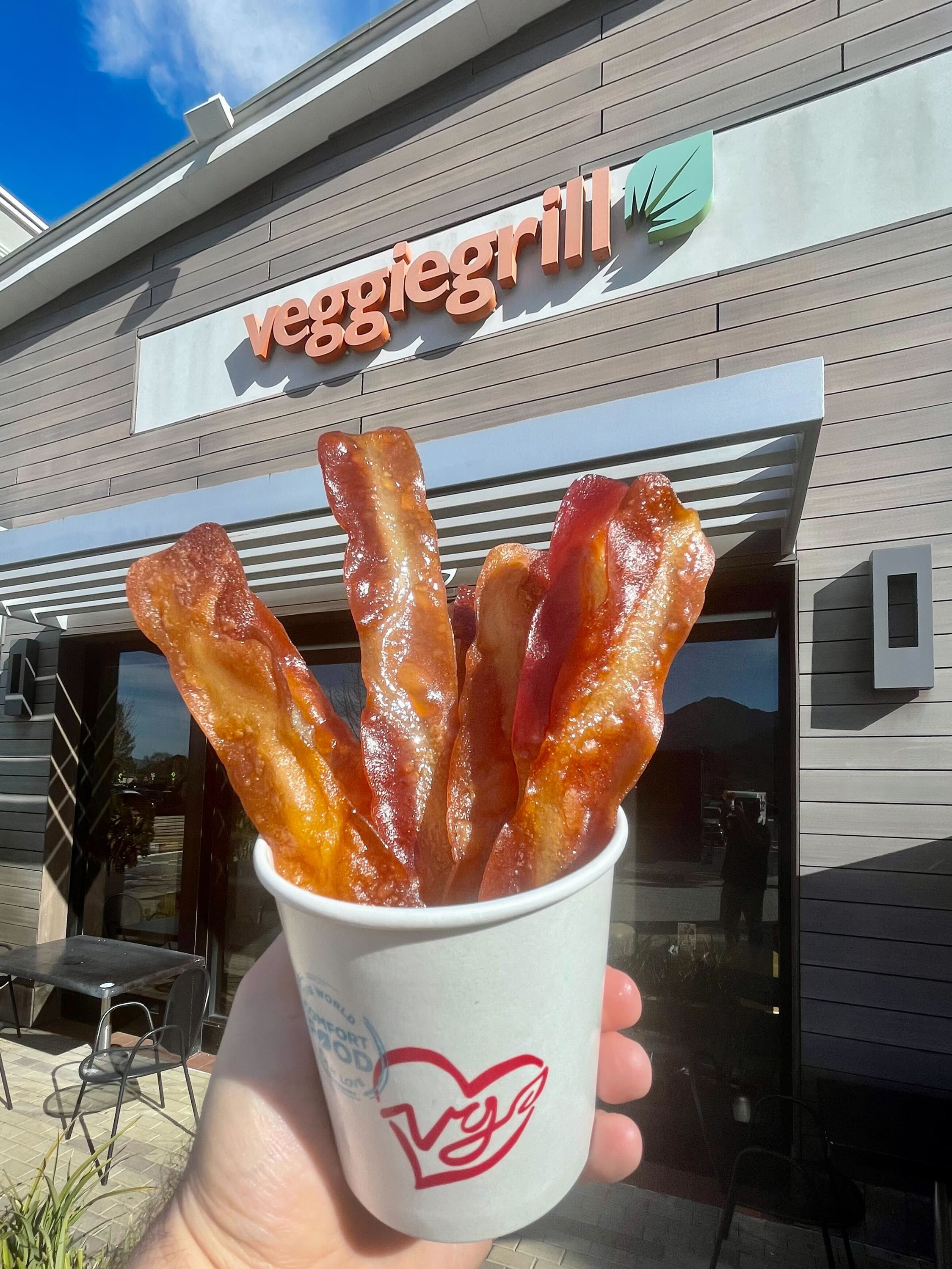 https://vegnews.com/media/35589/VegNews.VeganBaconVeggieGrill.HoorayFoods.jpg