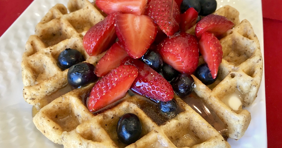 Golden Waffles With Berries and Warm Cinnamon Syrup (Gluten-Free!) | VegNews