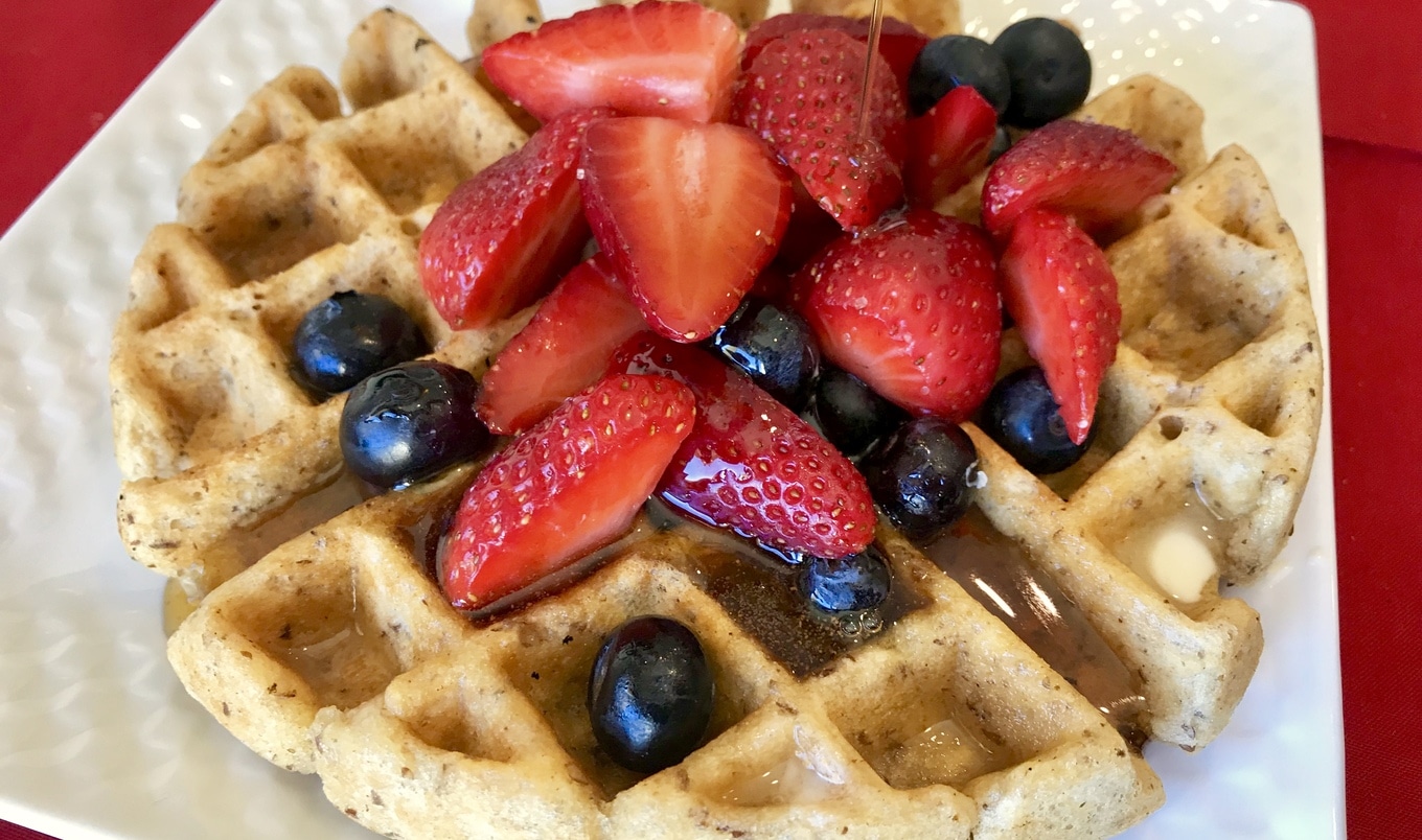 Gluten-Free Golden Waffles With Berries and Warm Cinnamon Syrup
