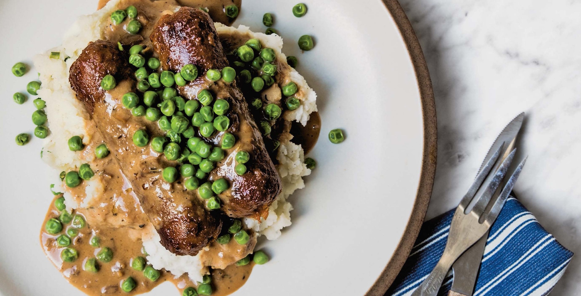 Meaty Vegan Bangers and Mash With Herbed Gravy