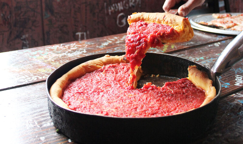 Gino's East famous cheese tomato deep dish pizza