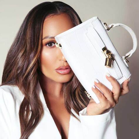 Cheetah Girls’ Adrienne Bailon Launches Vegan Handbag Line