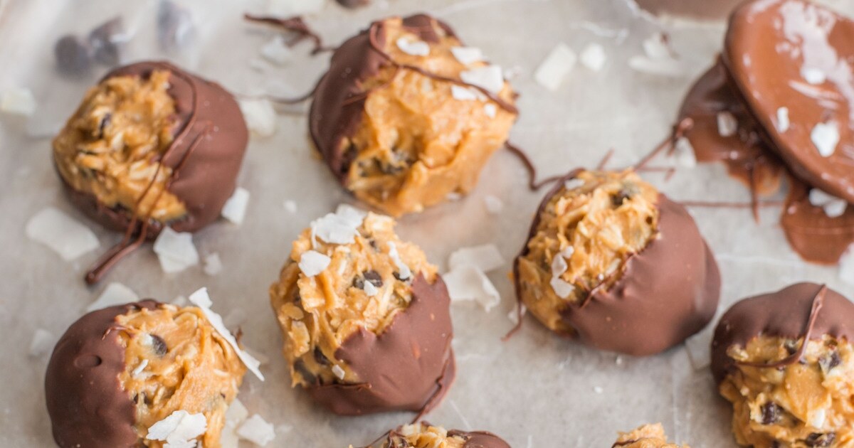 Chocolate-Dipped Peanut Butter Coconut Oat Bites | VegNews