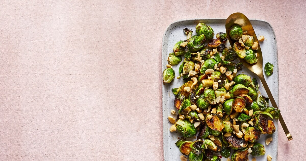 Crispy Brussels Sprouts With Tamarind and Cashews | VegNews