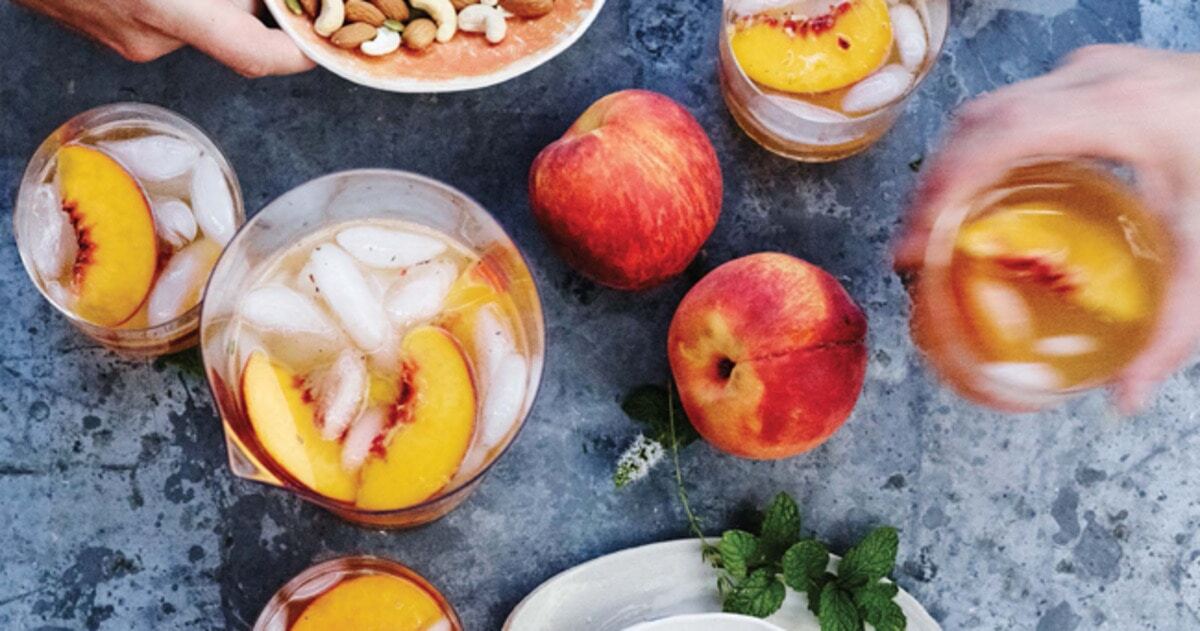 Boozy Ginger-Peach Mint Sangria | VegNews