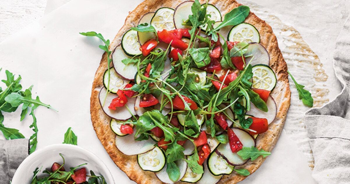 Roasted Potato Zucchini Pizza Topped With Arugula | VegNews