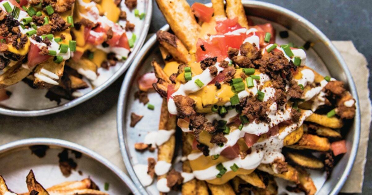 Supreme Vegan Nacho Fries With Tofu Bacon Crumbles | VegNews
