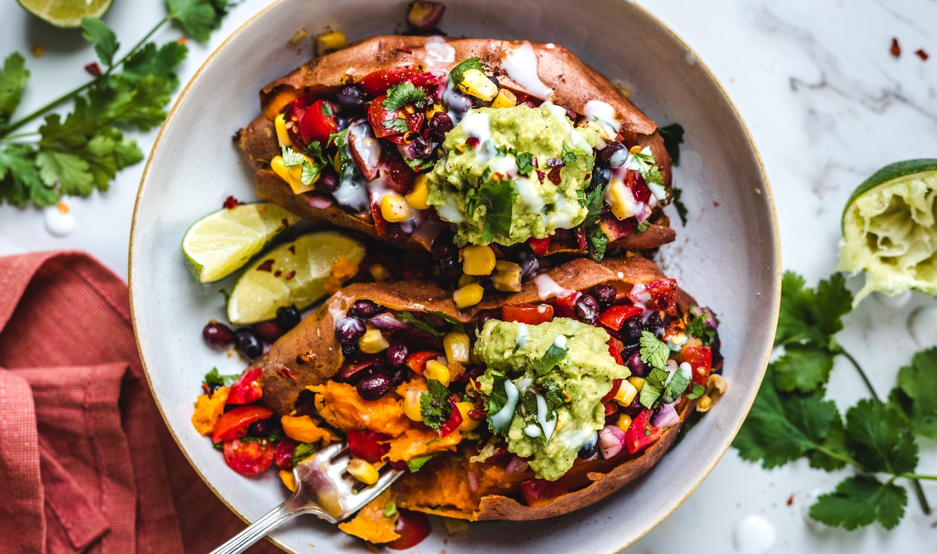 Black Bean-Stuffed Sweet Potatoes With Coconut Sour Cream and Guacamole