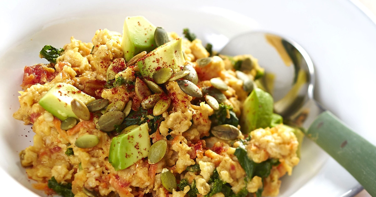 Cheesy Vegan Oatmeal Bowl With Kale and Pumpkin Seeds