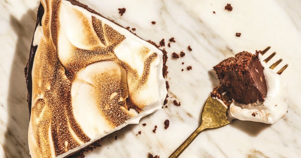 Vegan Chocolate Pecan Cheesecake With Toasted Meringue and Fudge Sauce | VegNews