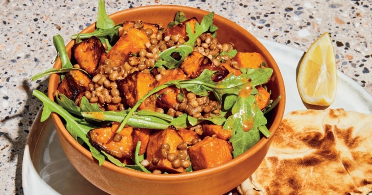 Warm Lentil, Sweet Potato, and Arugula Salad With Maple Mustard Dressing | VegNews