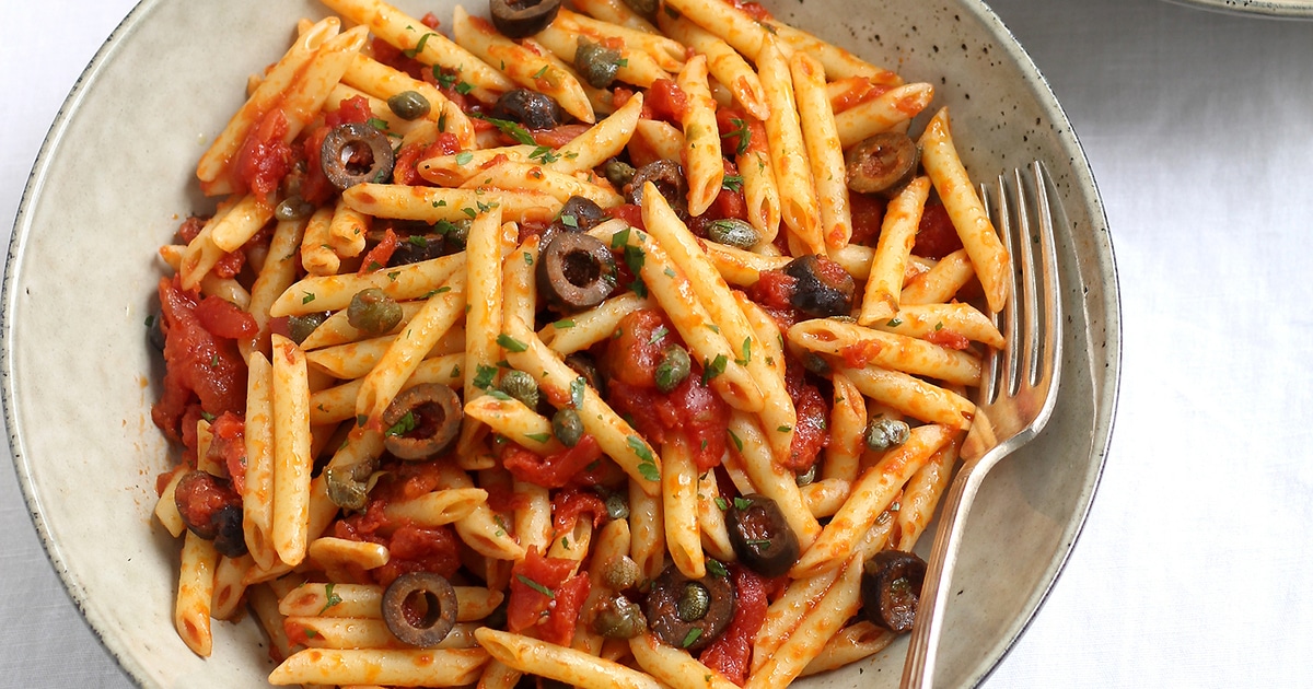 Vegan Penne Puttanesca With Salty Olives and Capers | VegNews