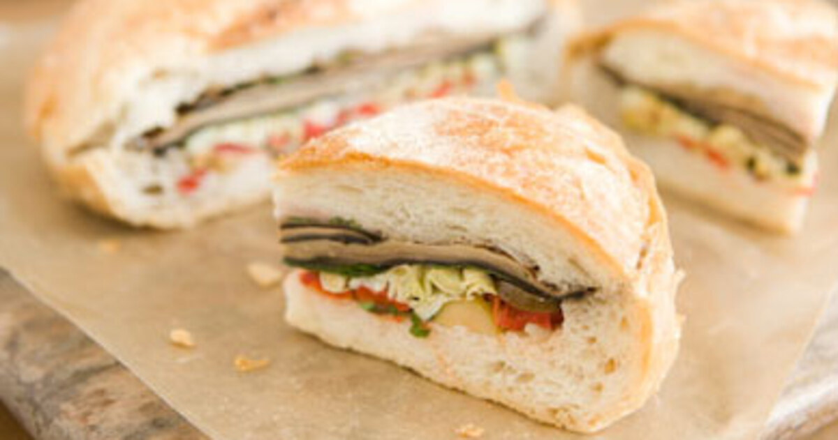 Stuffed Vegan Muffaletta Sandwich | VegNews