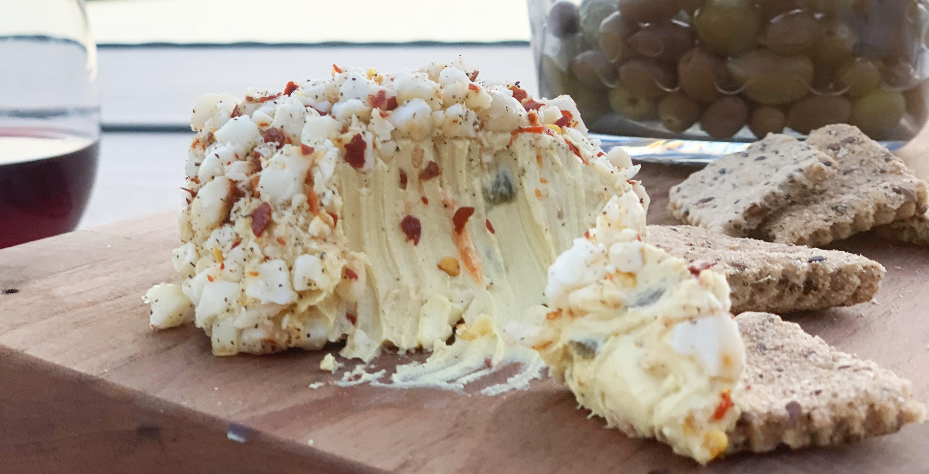 Vegan Macadamia Nut and Herb-Crusted Swiss Cheeseballs