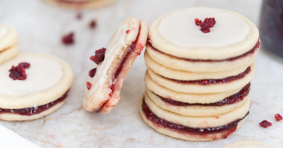 Vegan Shortbread Raspberry Jam Sandwich Cookies With Vanilla Icing | VegNews