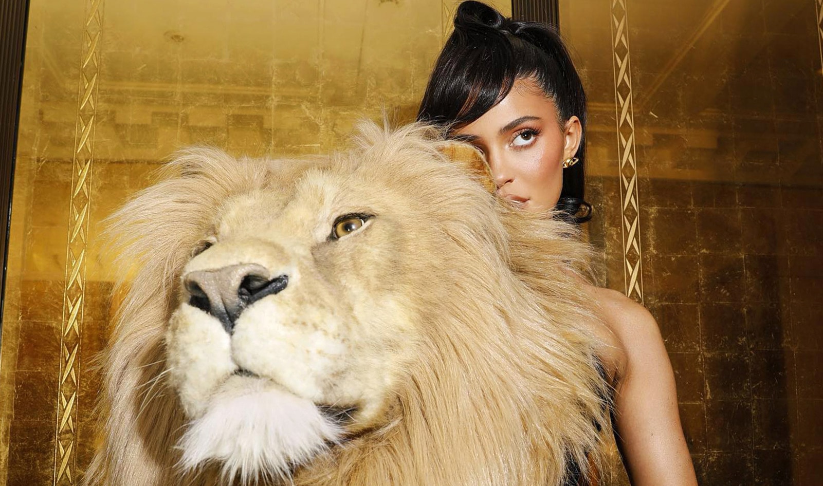 Kylie Jenner Accessorizes With a Giant Faux Lion Head for Paris