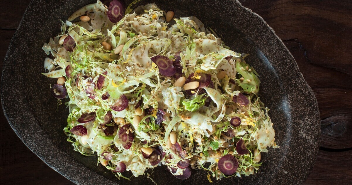 Vegan Shaved Brussels Sprouts With Za’atar, Lemon, and Pine Nuts | VegNews