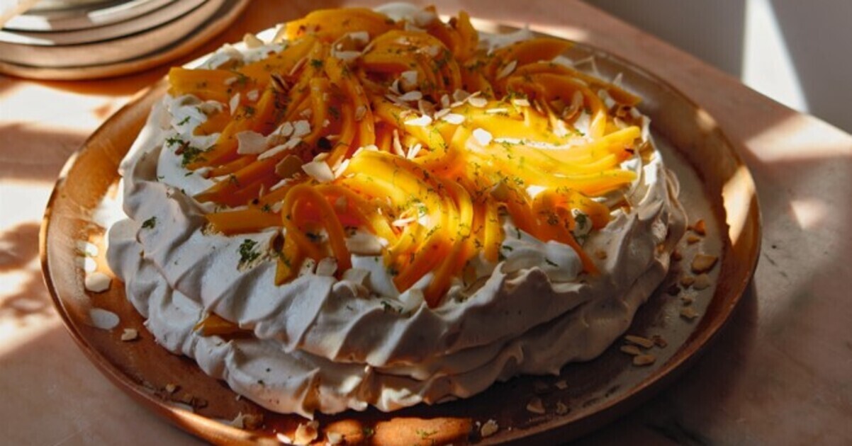 Fresh Mango Pavlova With Vanilla Cream | VegNews