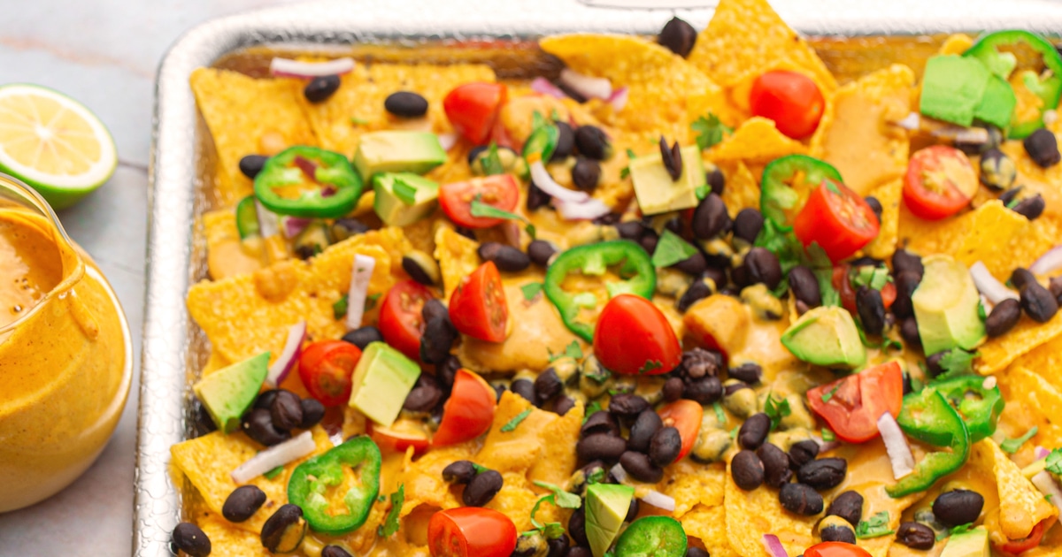 Loaded Cheesy Vegan Nachos  | VegNews