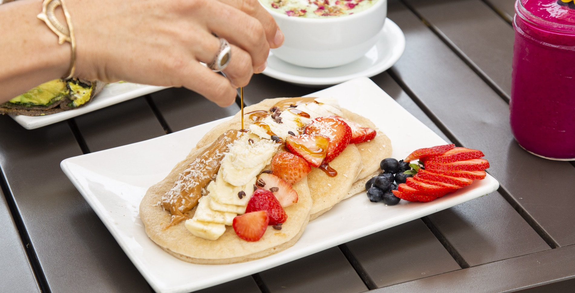 Fluffy Vegan, Gluten-Free Pancakes With Strawberries, Bananas, and Peanut Butter
