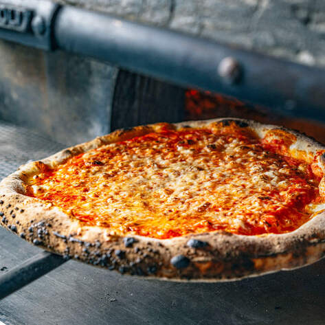 This $23 Billion Pizza Giant Just Invested in Vegan Cheese