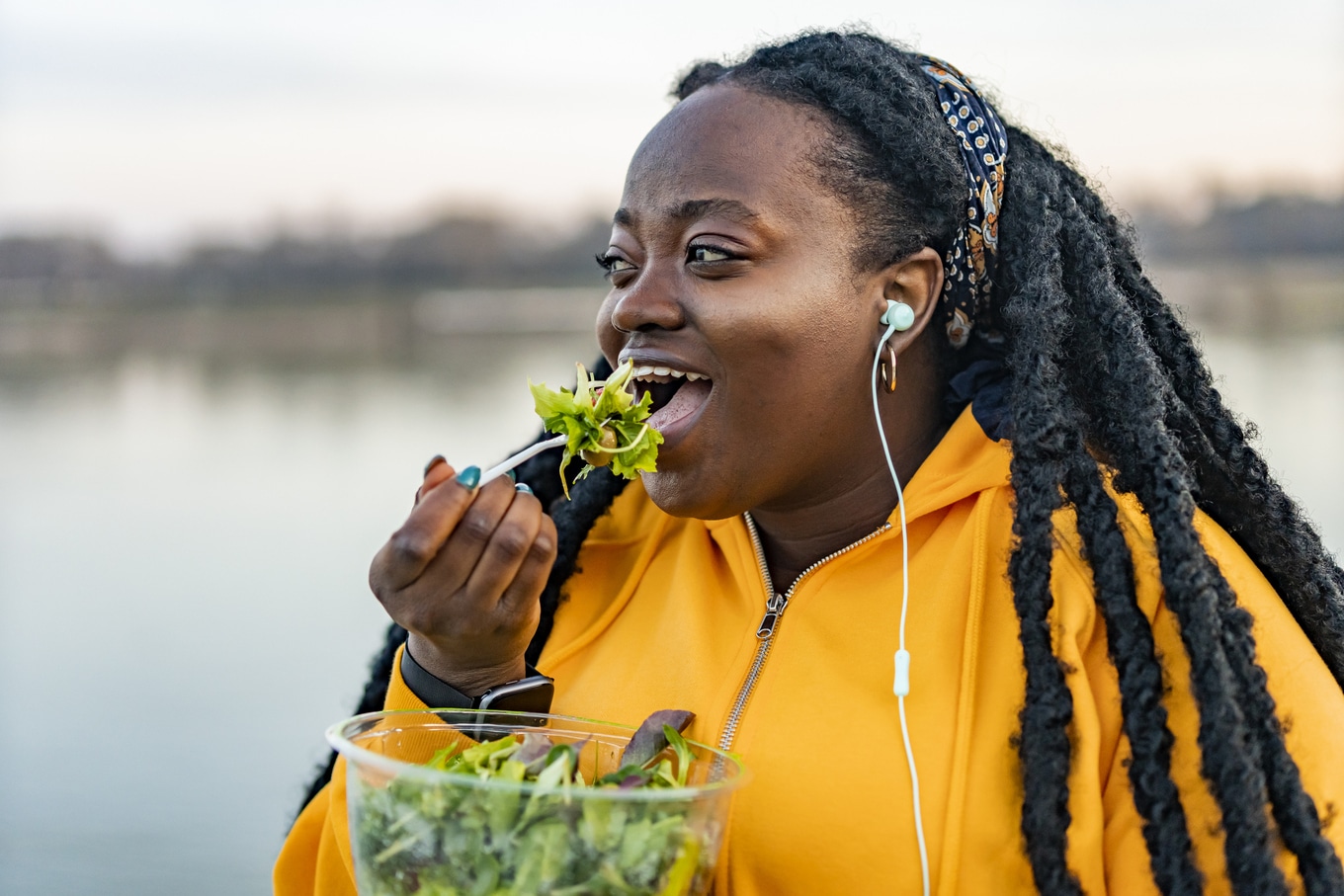 VegNews.HeartHealthWomanEating.ljubaphotoGetty