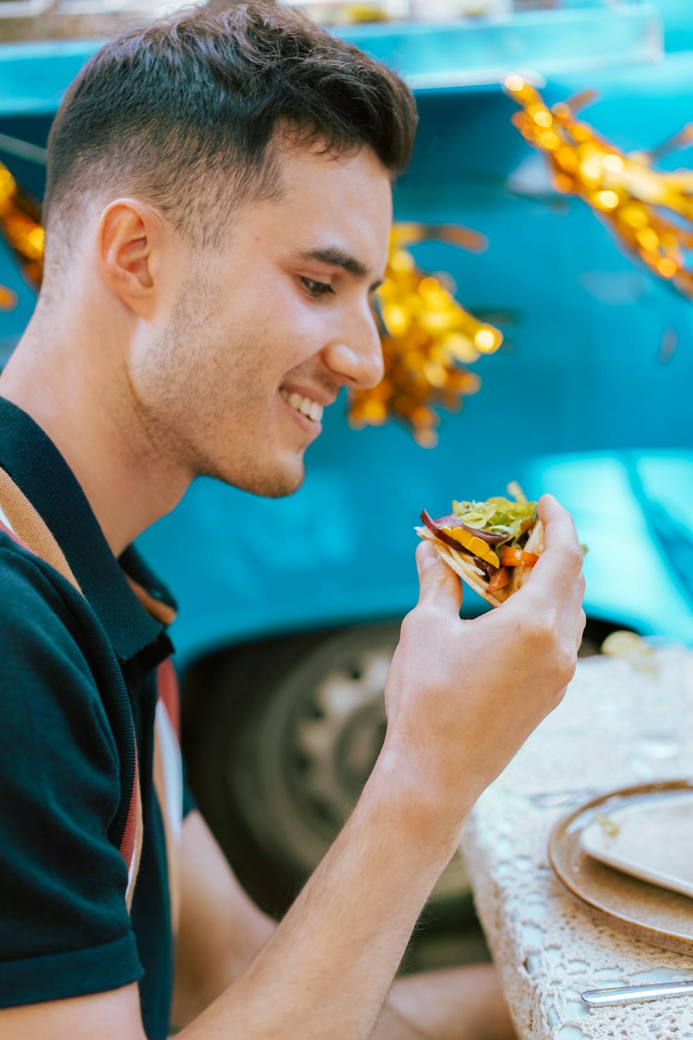 man eating taco