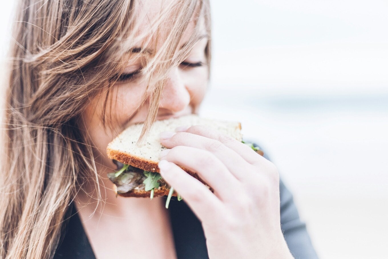 Woman eating a sandwich