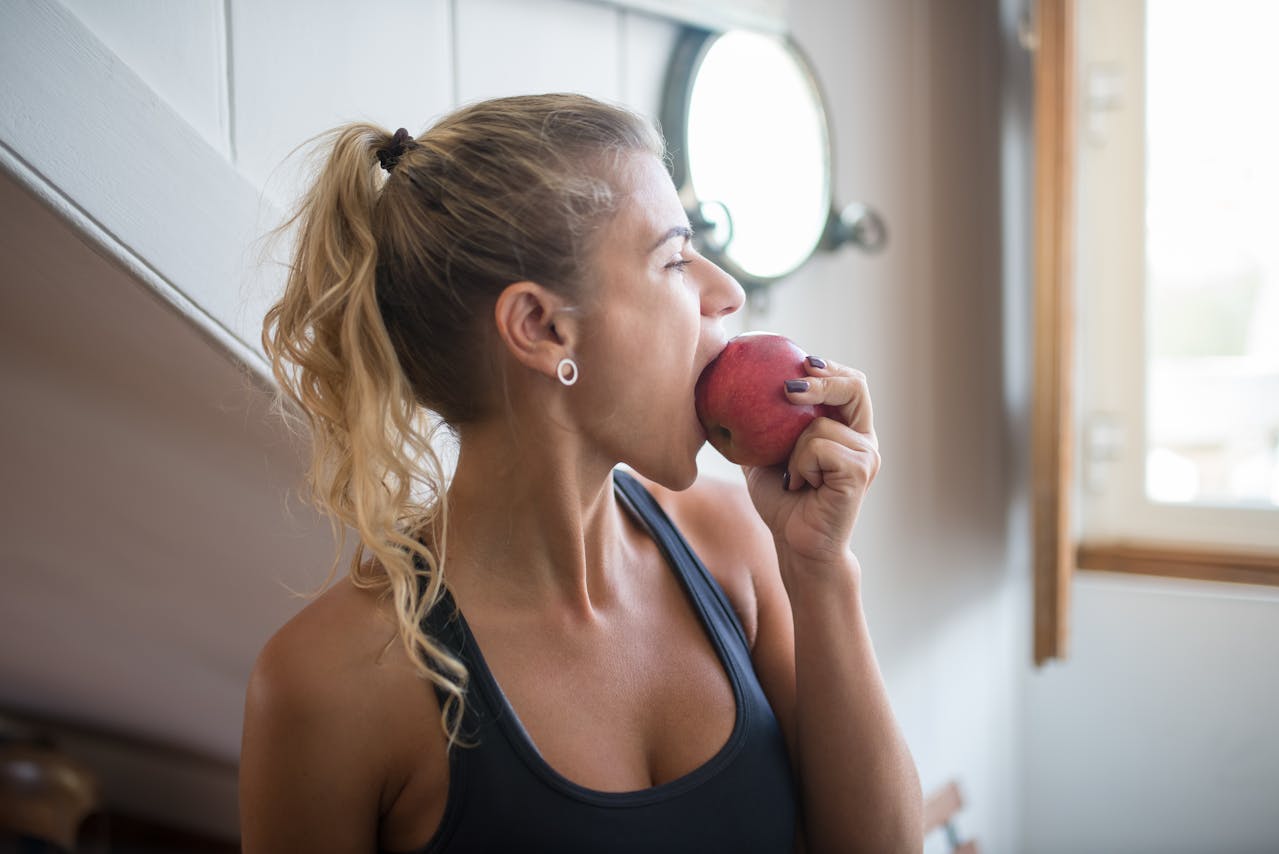 woman eats apple