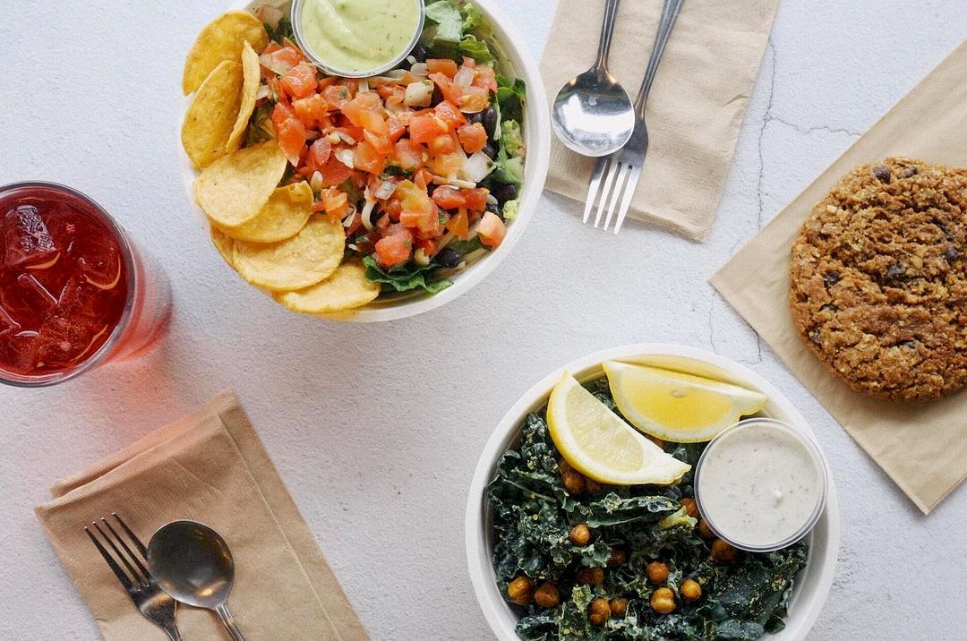 Laughing Planet salads, cookie, and drink