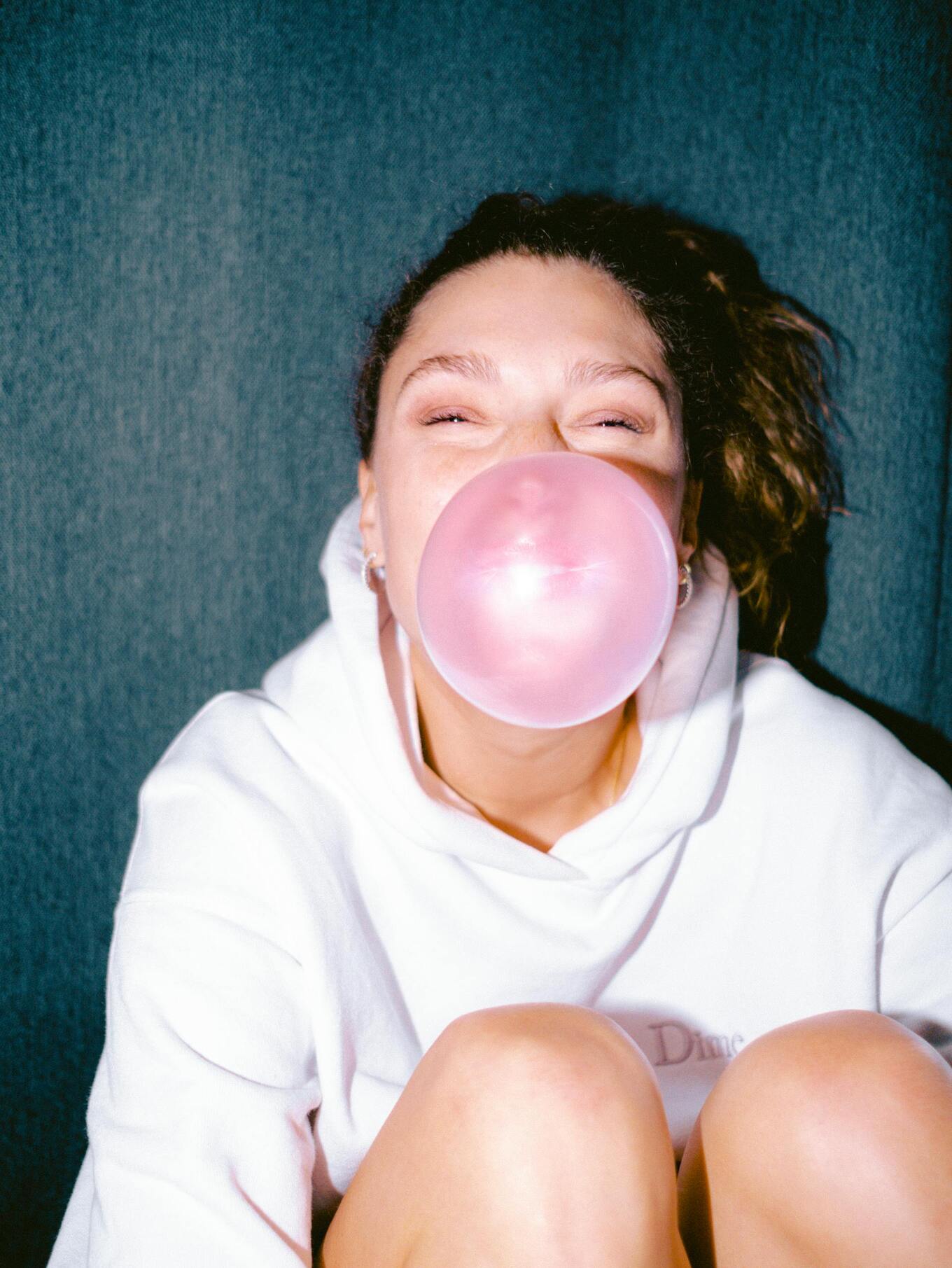 woman chewing gum bubble