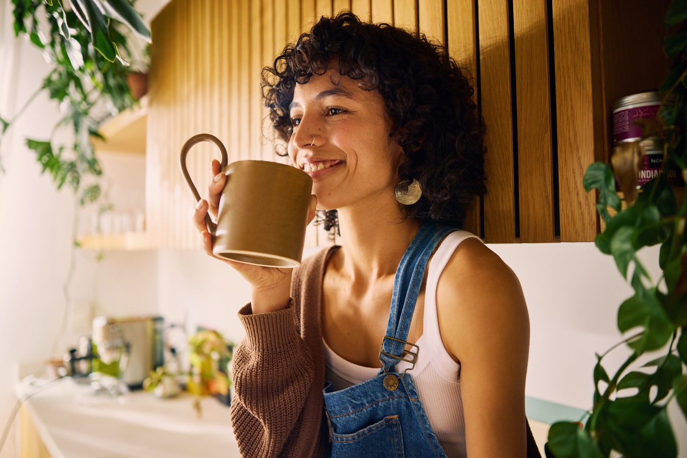 woman drinking coffee and smiling