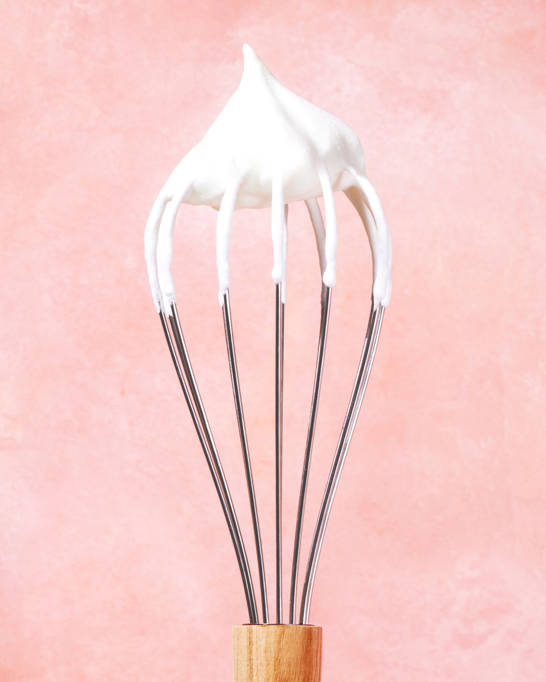 whipped heavy cream on whisk