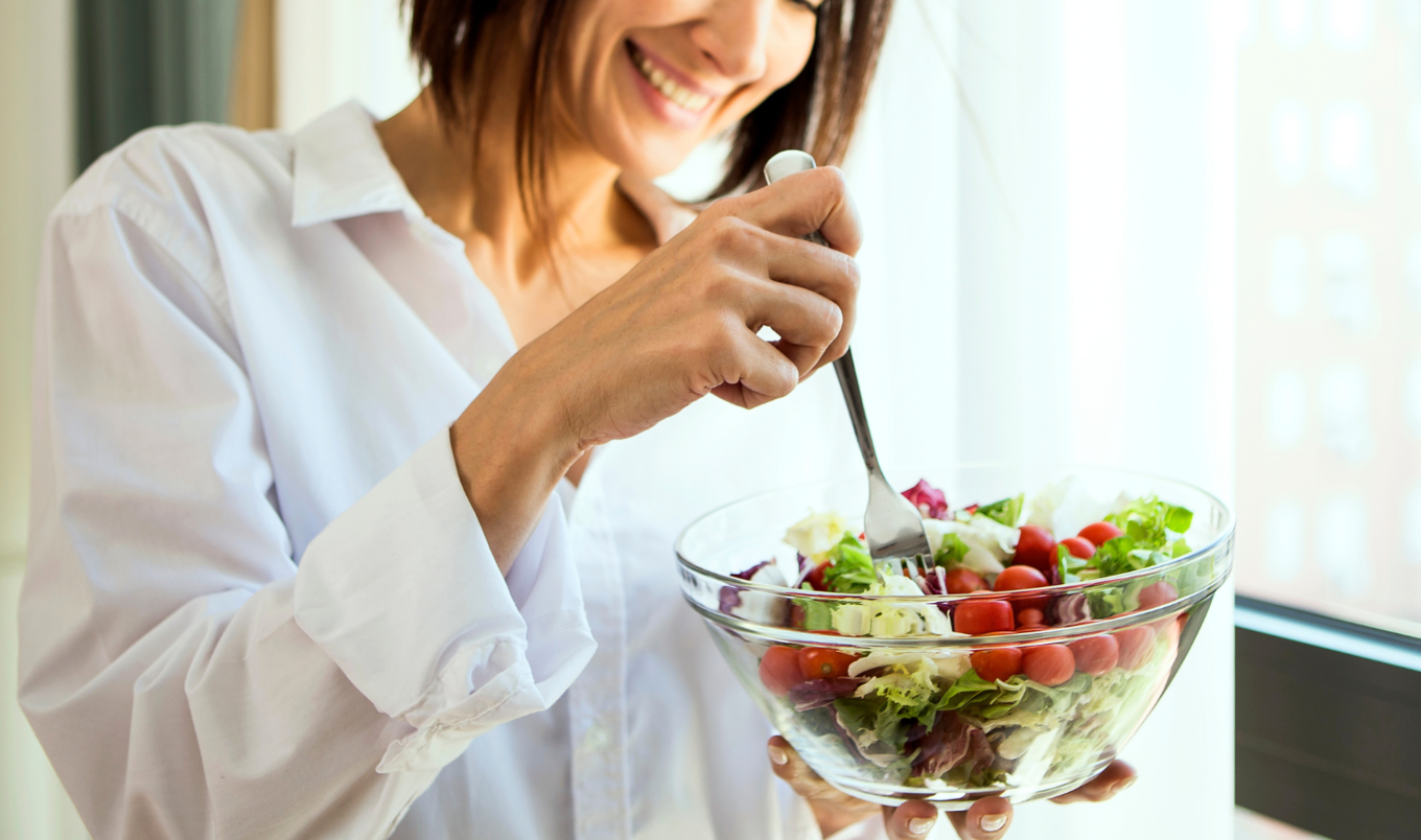 woman eating salad