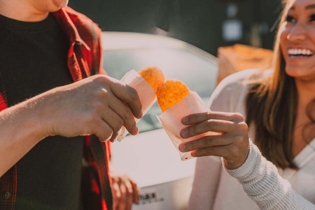 people cheersing hash browns