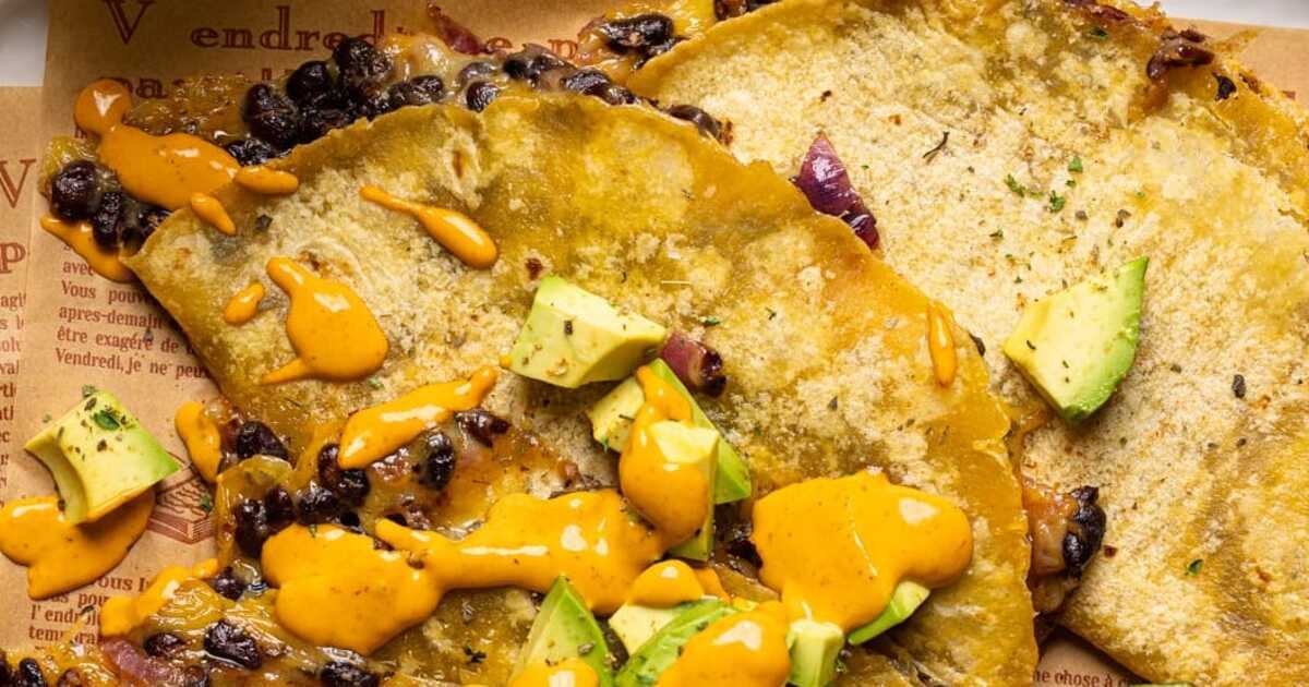 Baked Black Bean Tacos With Lime-Chipotle Sauce | VegNews