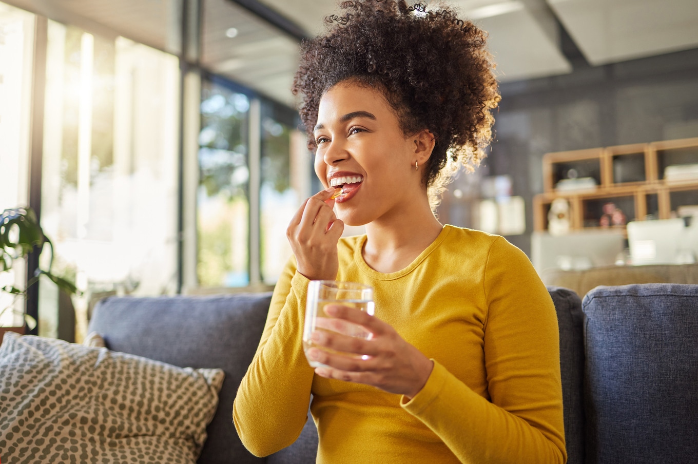 VegNews.WomanPillMedicineSupplements.Getty