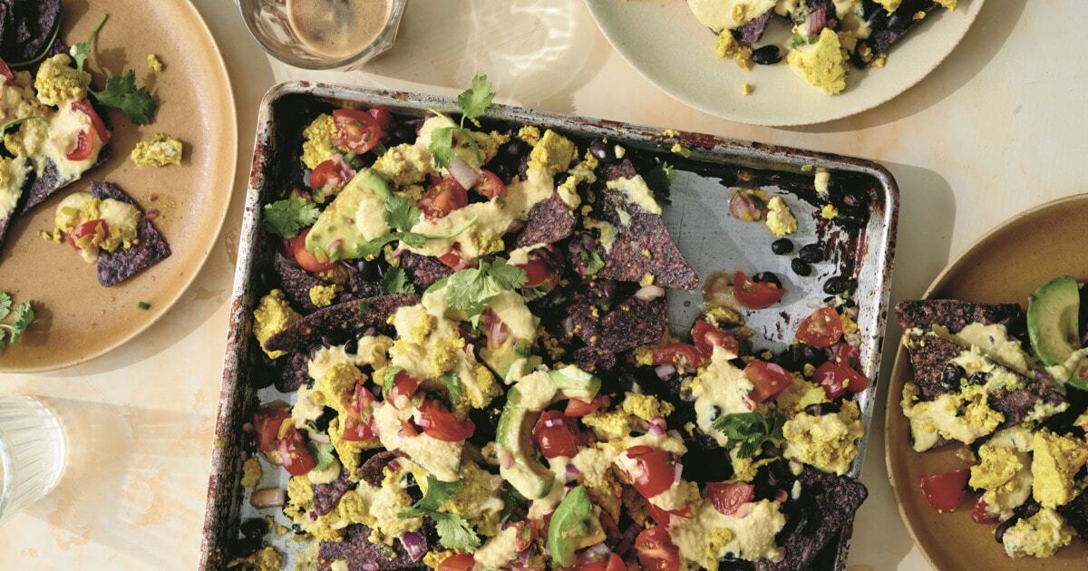 Loaded Breakfast Nachos With Cashew Cheese Sauce and Tofu Scramble | VegNews