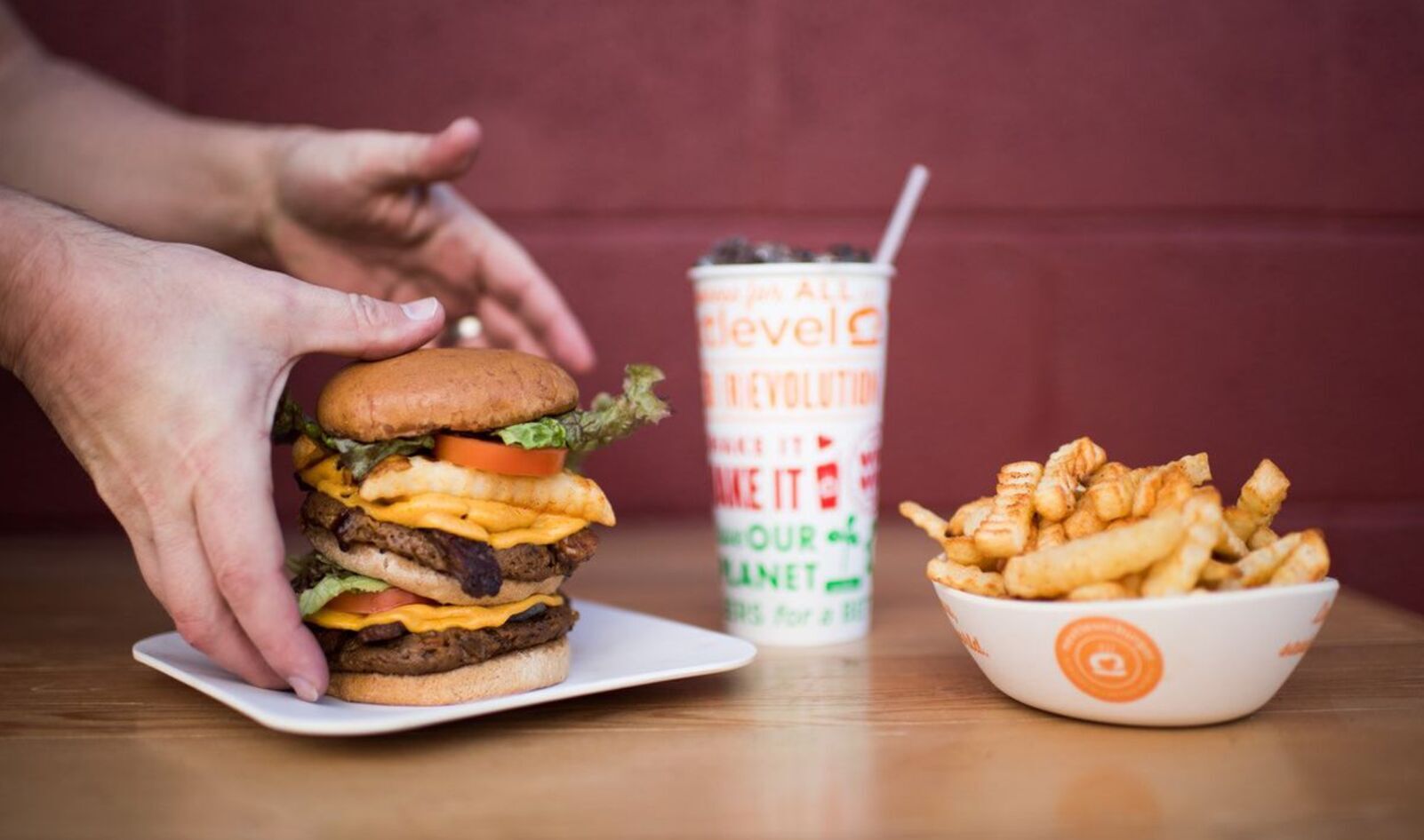 Next Level Burger Acquires Veggie Grill to Form Largest Vegan Burger Chain: “We’re Just Getting Started”