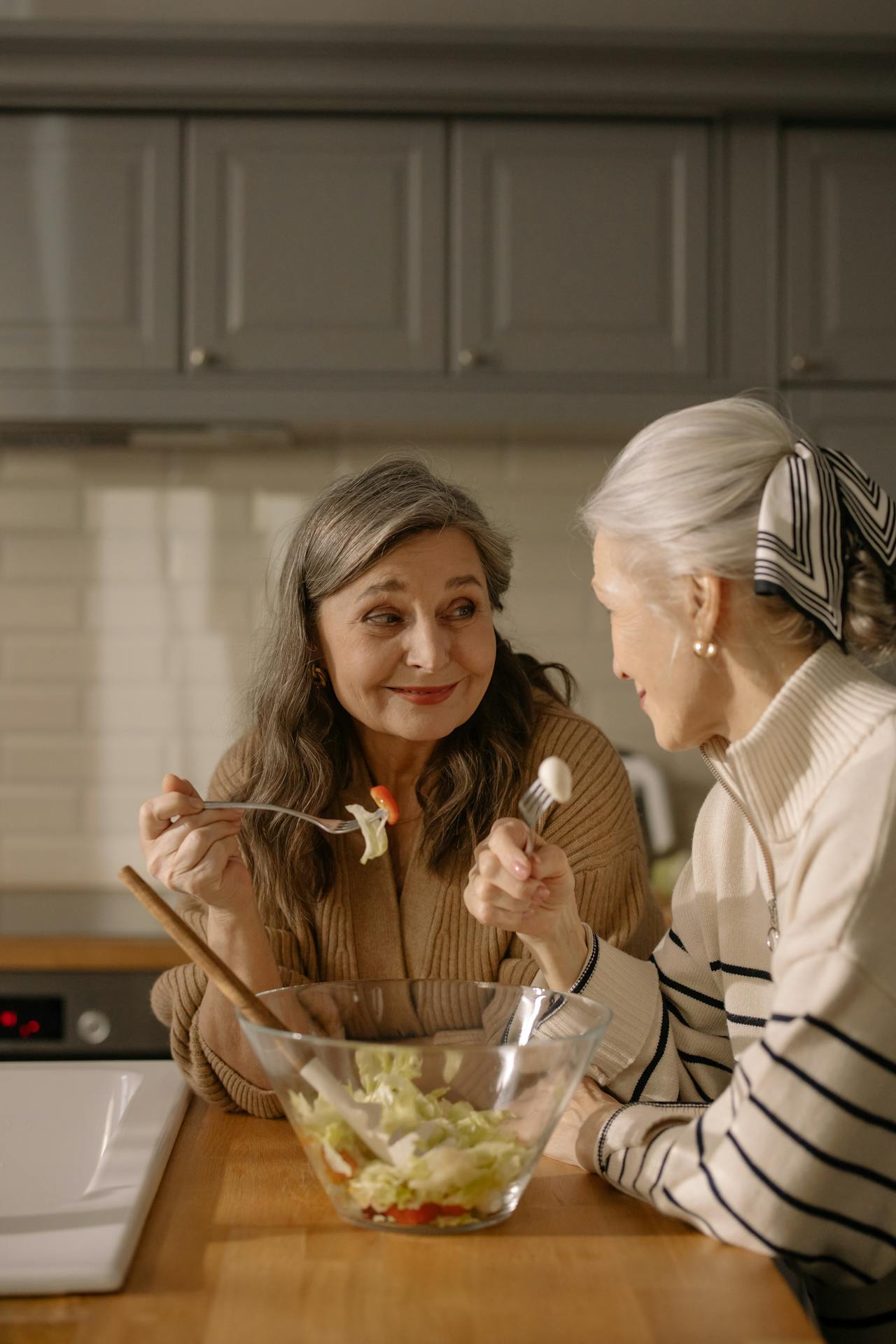 women sharing salad