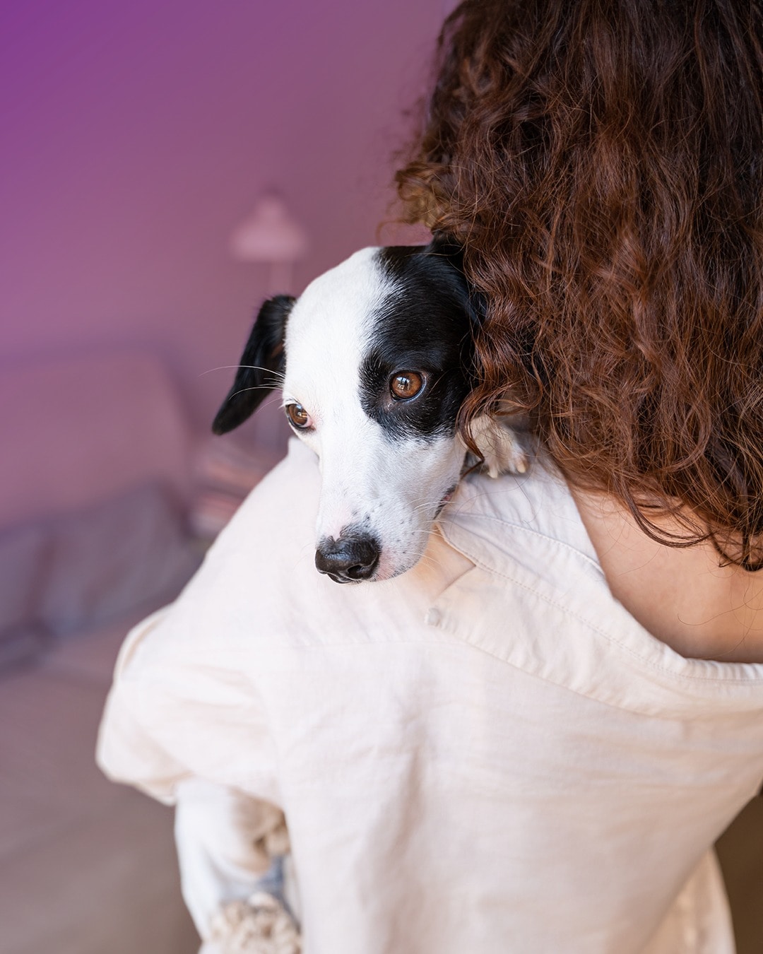 woman holding dog