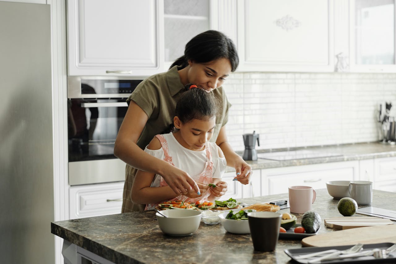 woman and daughter preparing healthy food