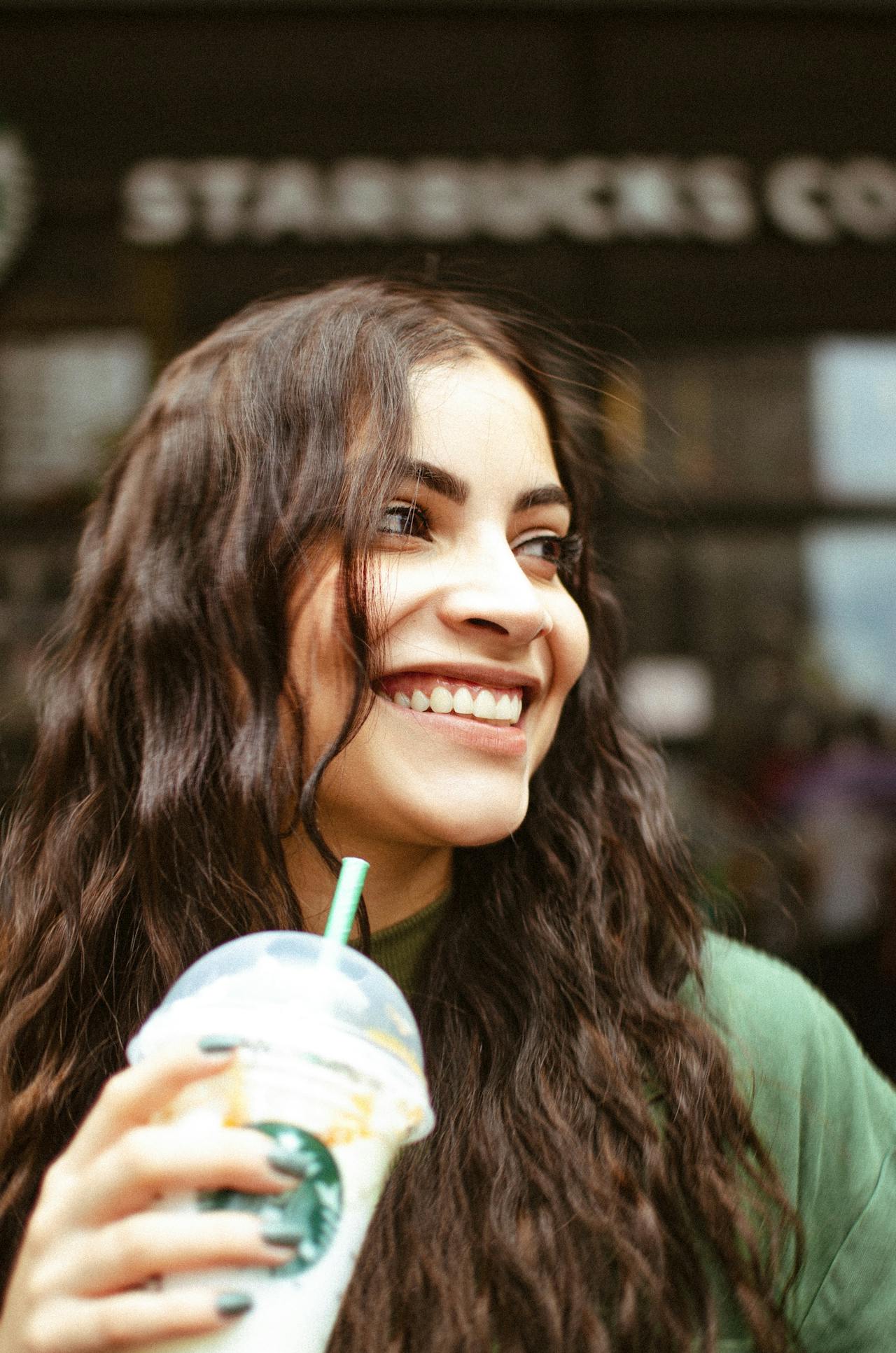 woman holding starbucks