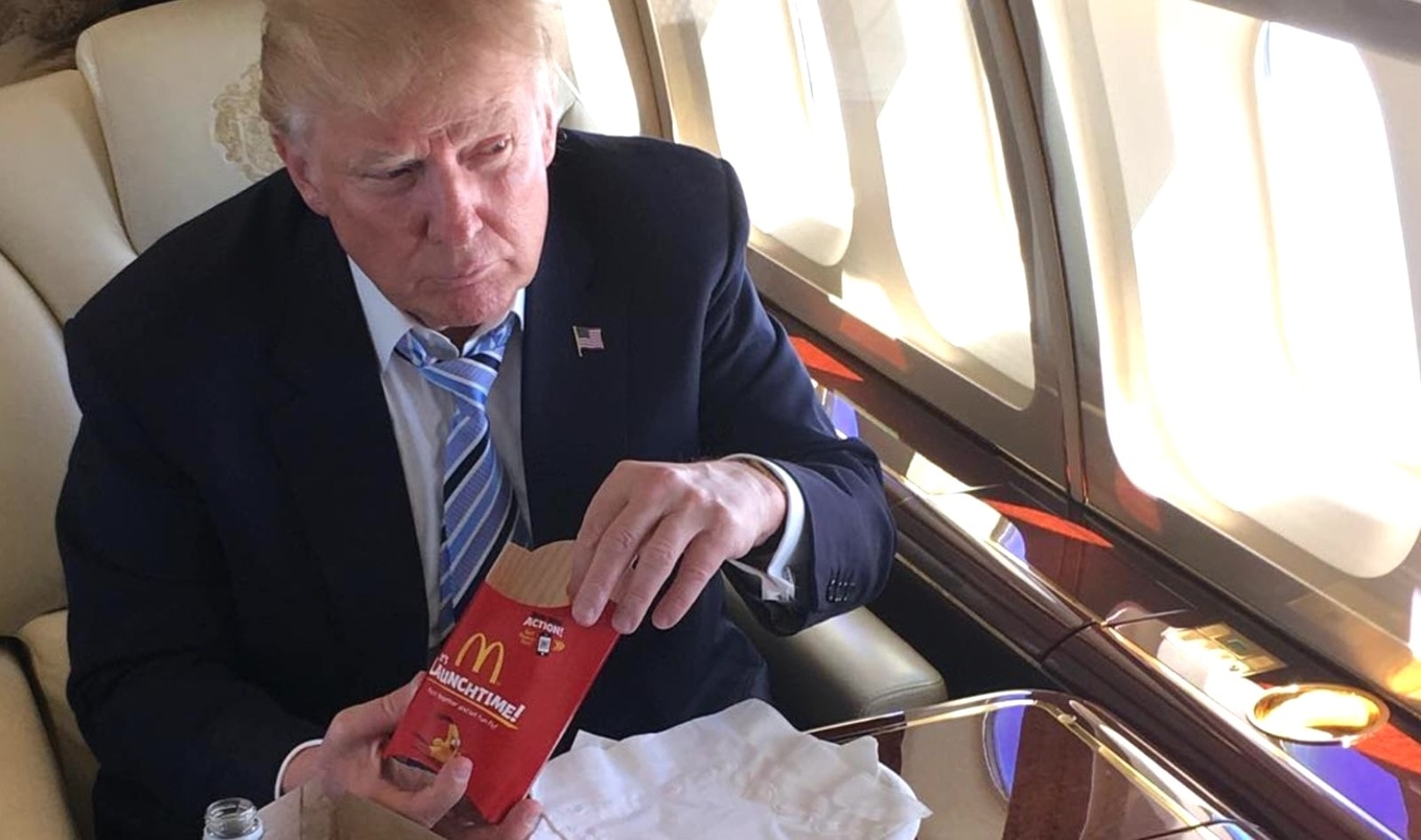 Donald Trump eating McDonald's fries on plane