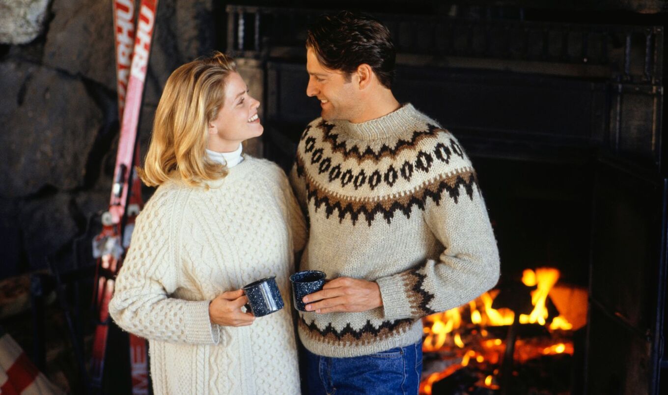 couple in front of fireplace