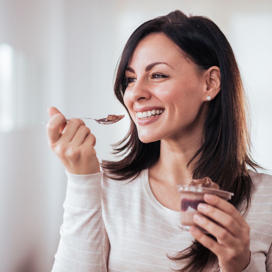 happy woman eating dessert