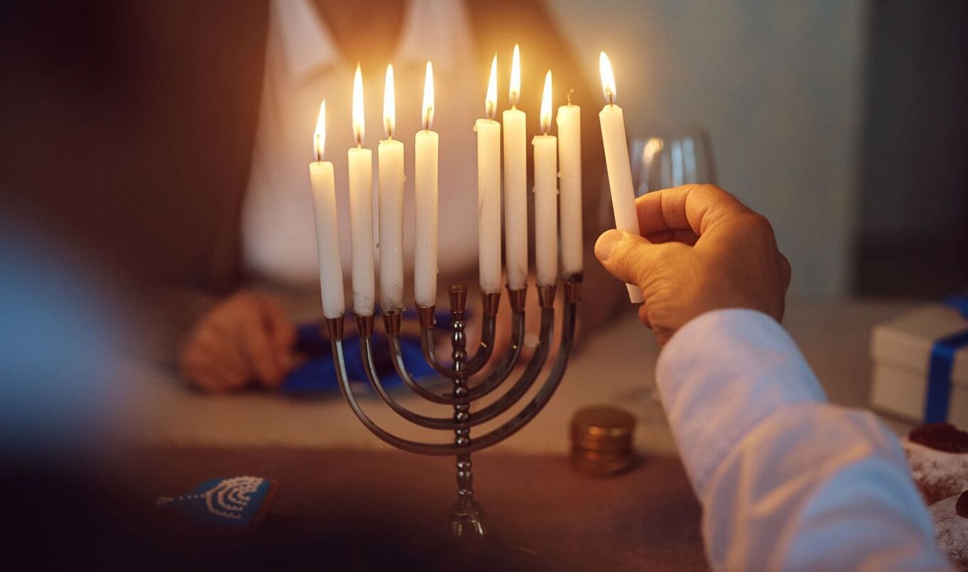 lighting a Hanukkah menorah