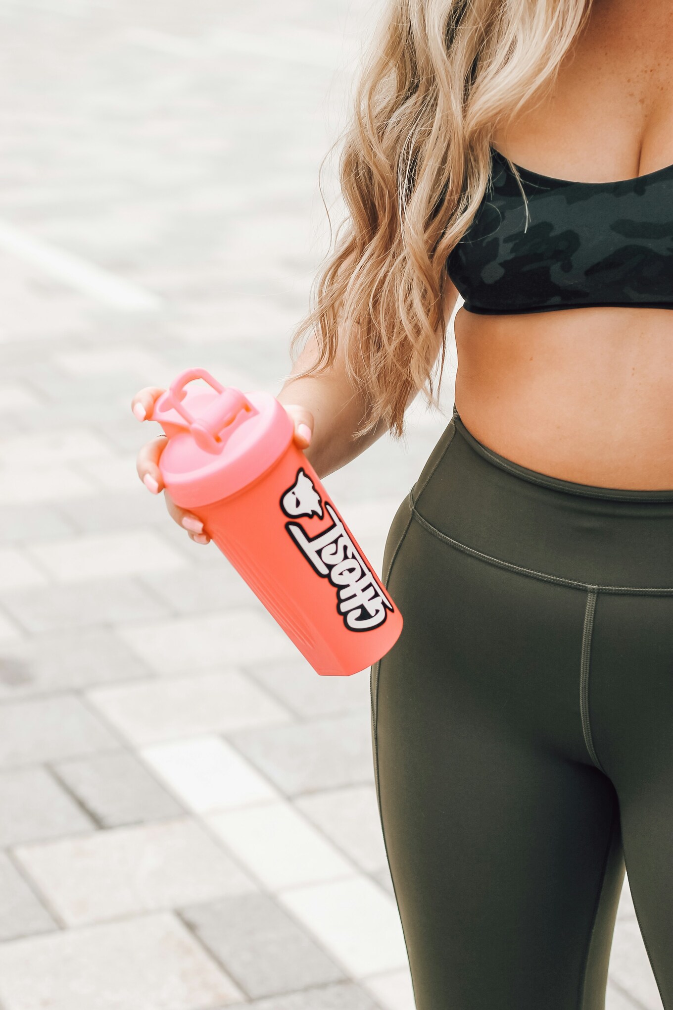 woman with protein drink bottle