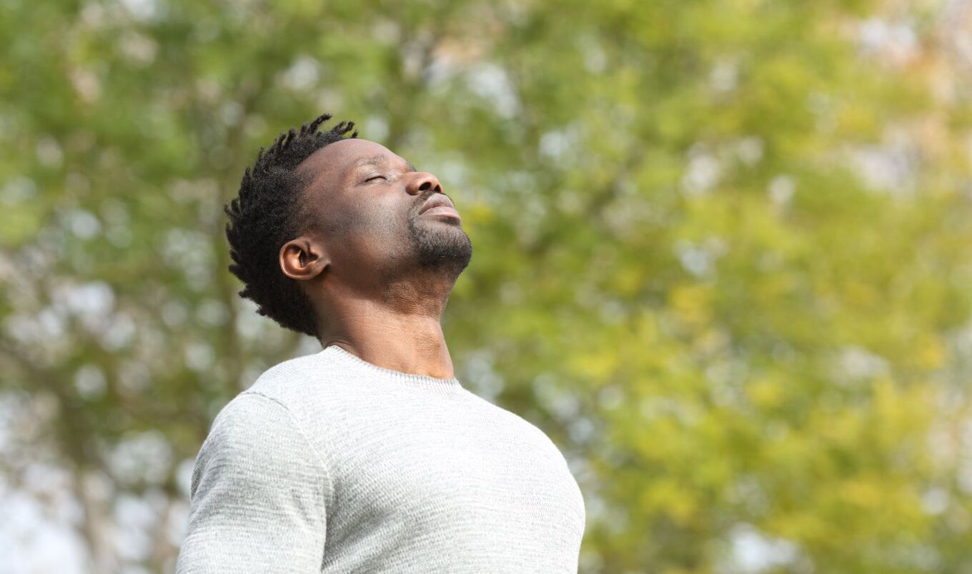 men inhaling deeply in nature