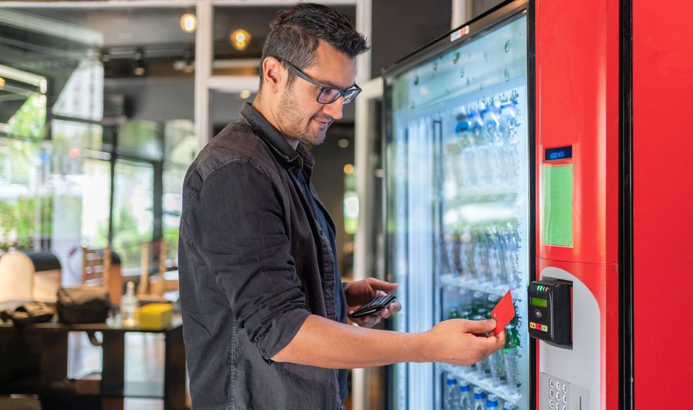 man buying from vending machine